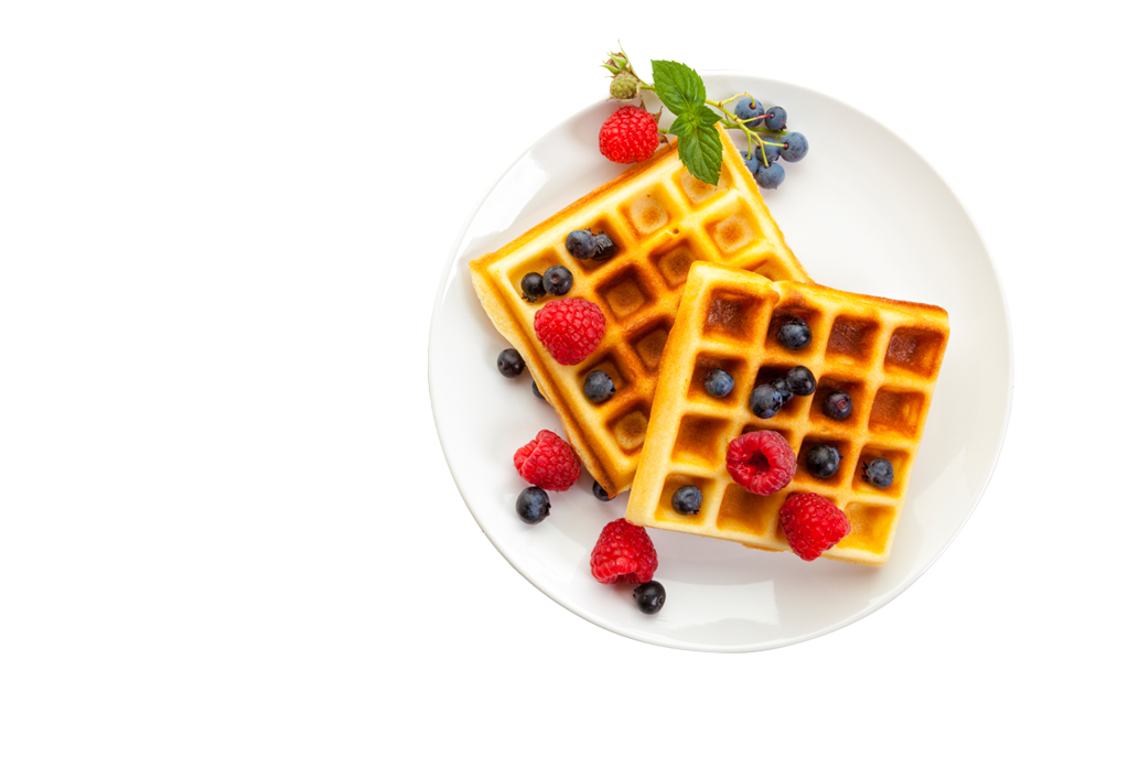 Homemade Belgian Waffles with raspberries and blueberries on plate, high angle view, with copy space